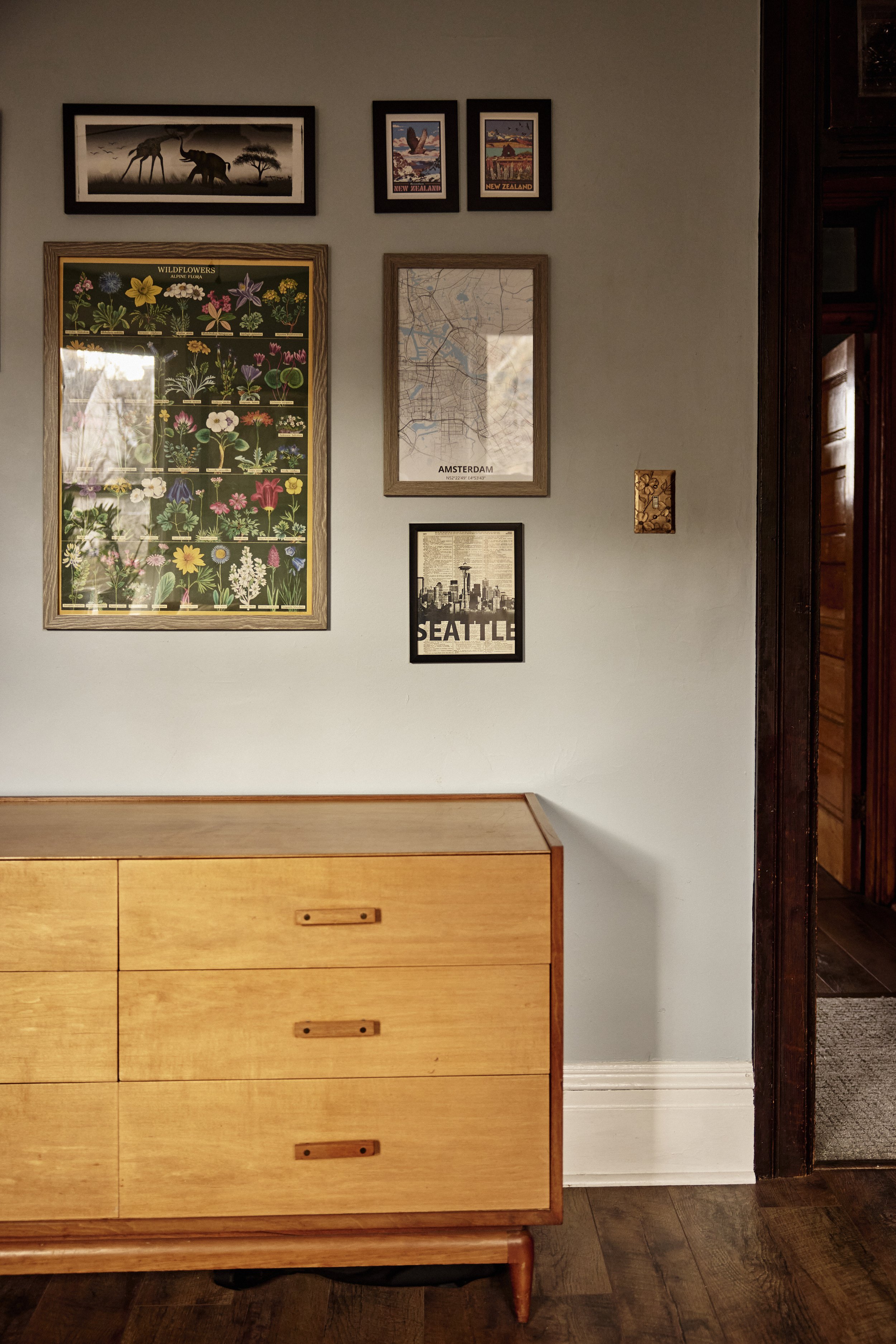 Gallery wall in the hall of this Pittsburgh, PA townhome. Image by Austin-based lifestyle photographer, Mackenzie Smith.