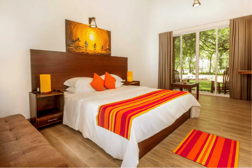 Tranquil Wild Boutique Hotel deluxe double with pool and lake view.png