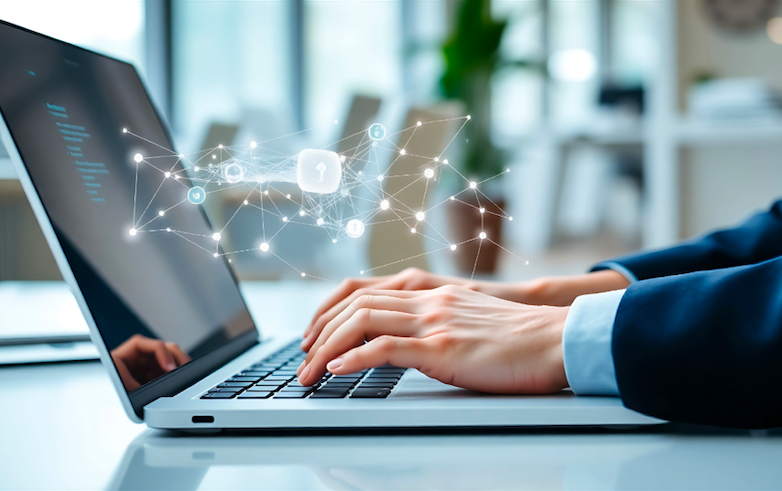 Person in business attire typing on a laptop with digital data and network graphics overlay.