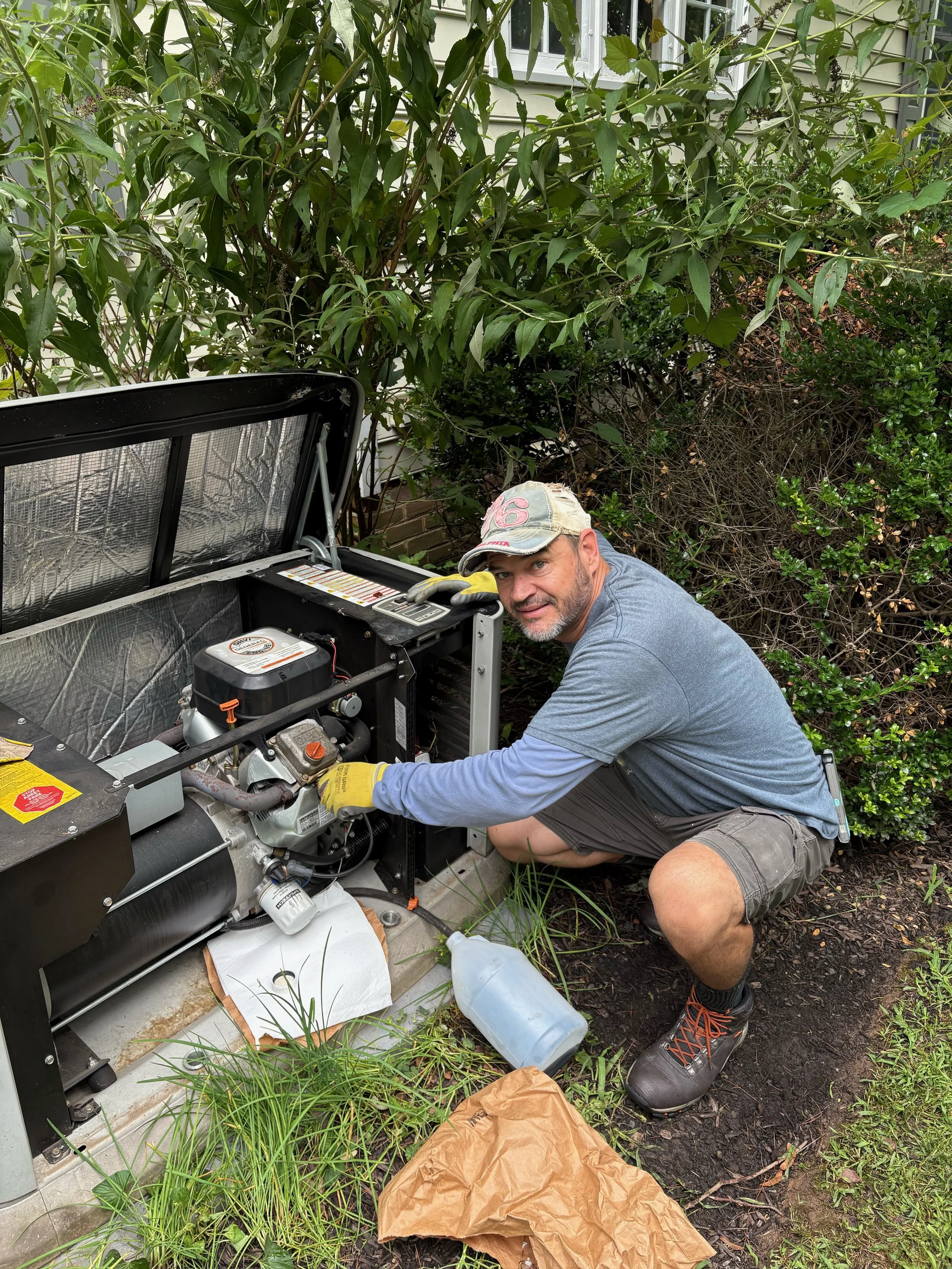 Oranssi technician working on a roof project