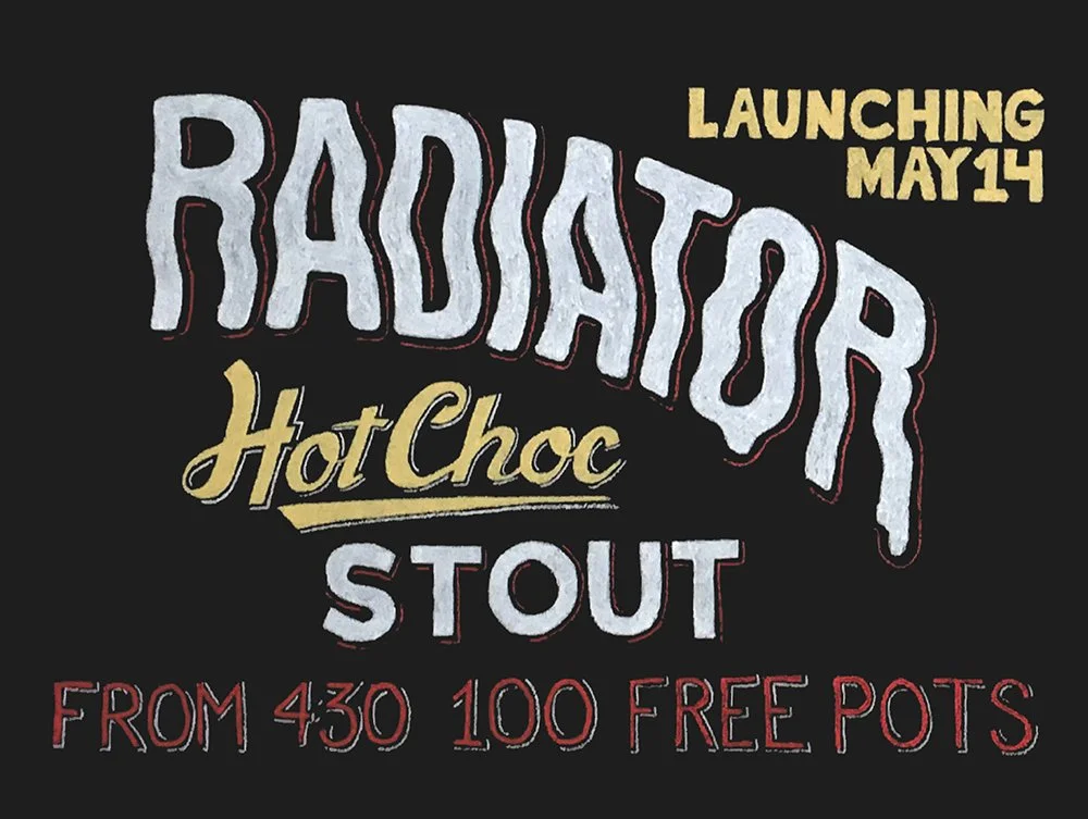 A black chalkboard with the words 'Radiator Hot Choc Stout" written on it in a melting looking font