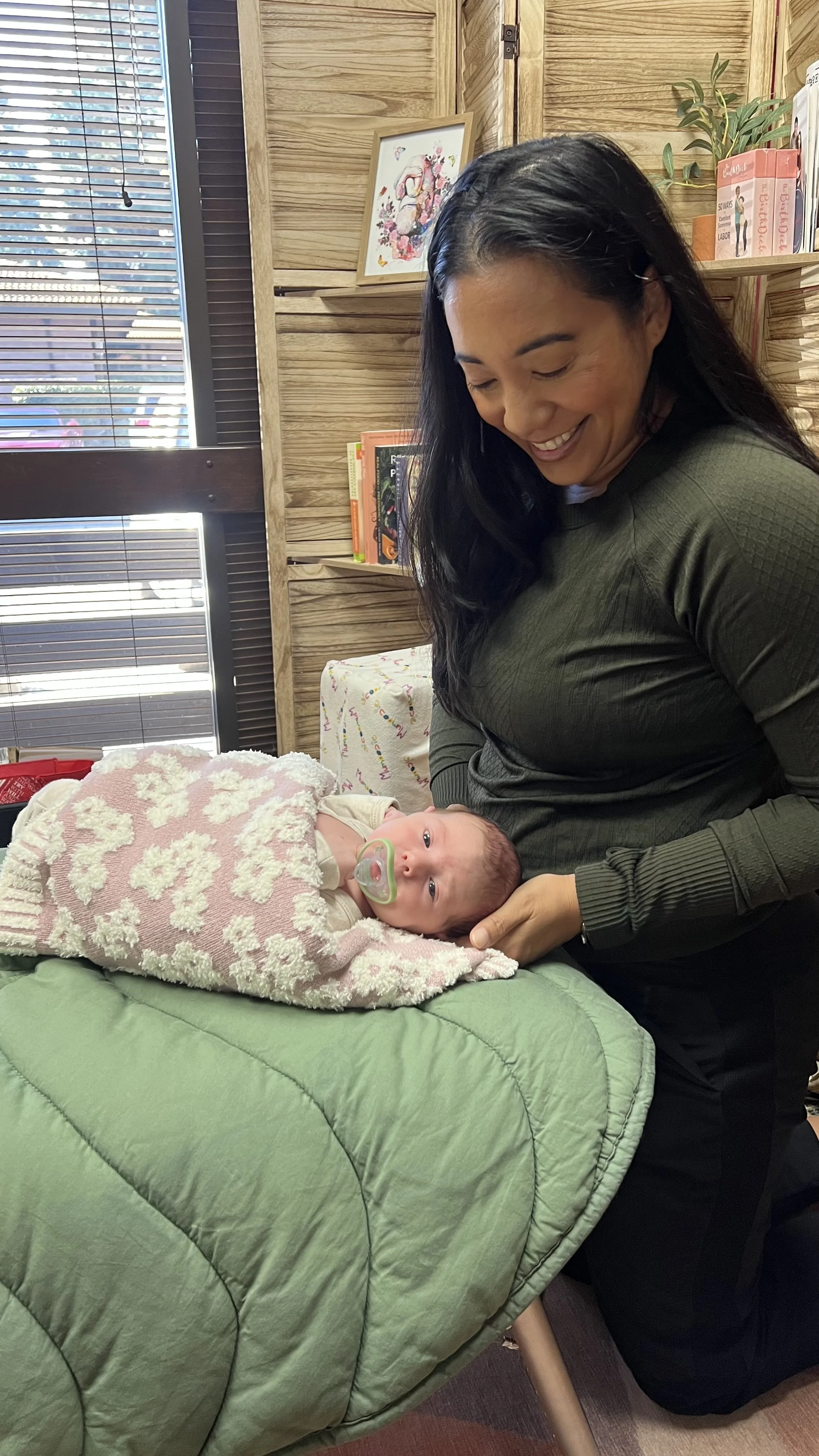 Dr. Ciara practices gentle cranial therapy for a infant.