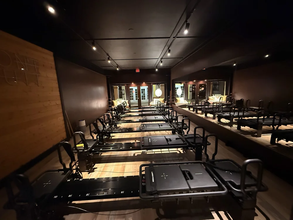 The FLY Lagree Fitness studio in Poipu, with rows of Lagree machines under warm lights