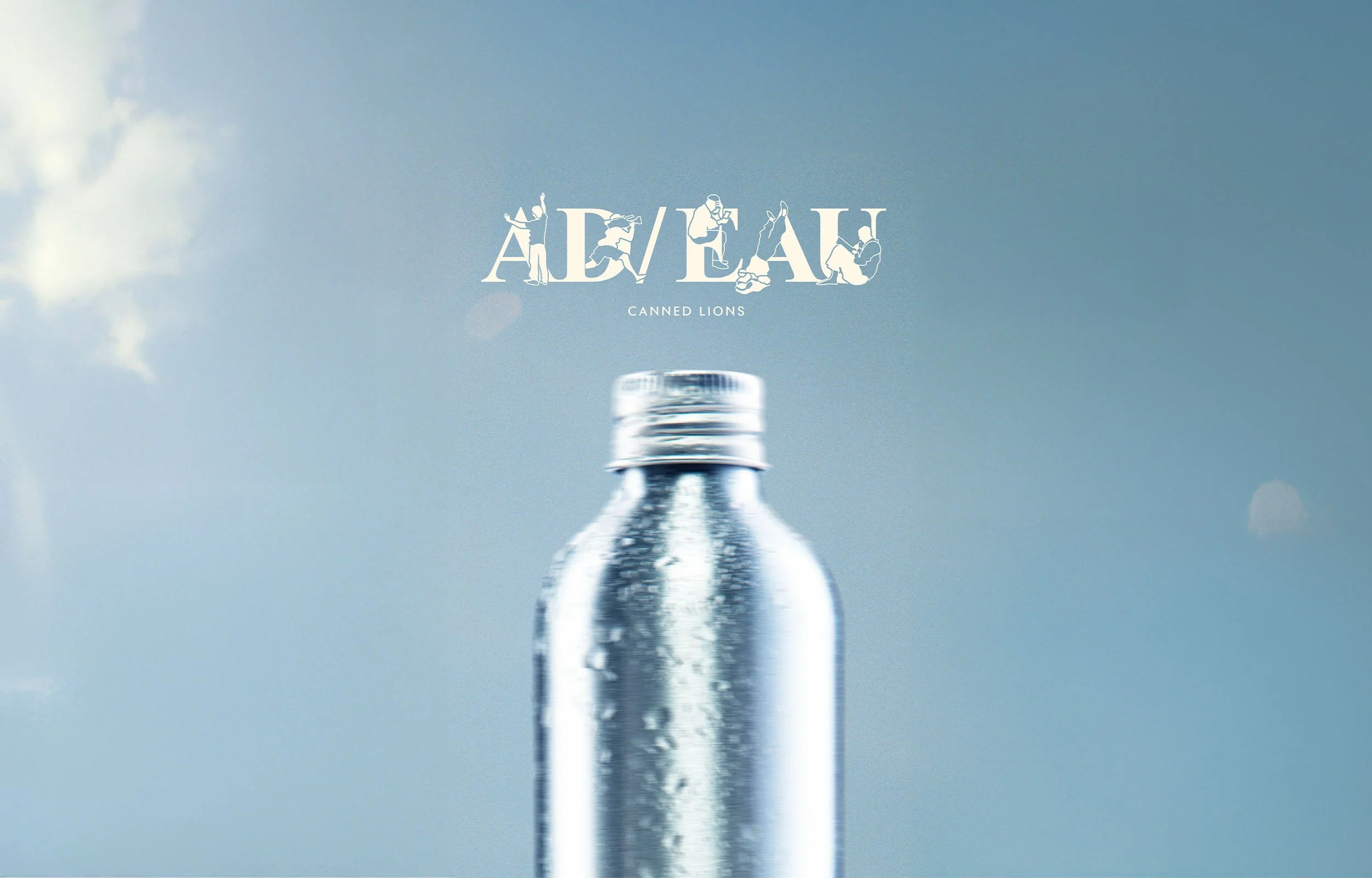 A small, metallic, silver bottle with a screw cap against a blue sky with some clouds. The word 'ADVEAL' with stylized figures is overlaid on the sky, and the phrase 'CANNED LIONS' appears below.