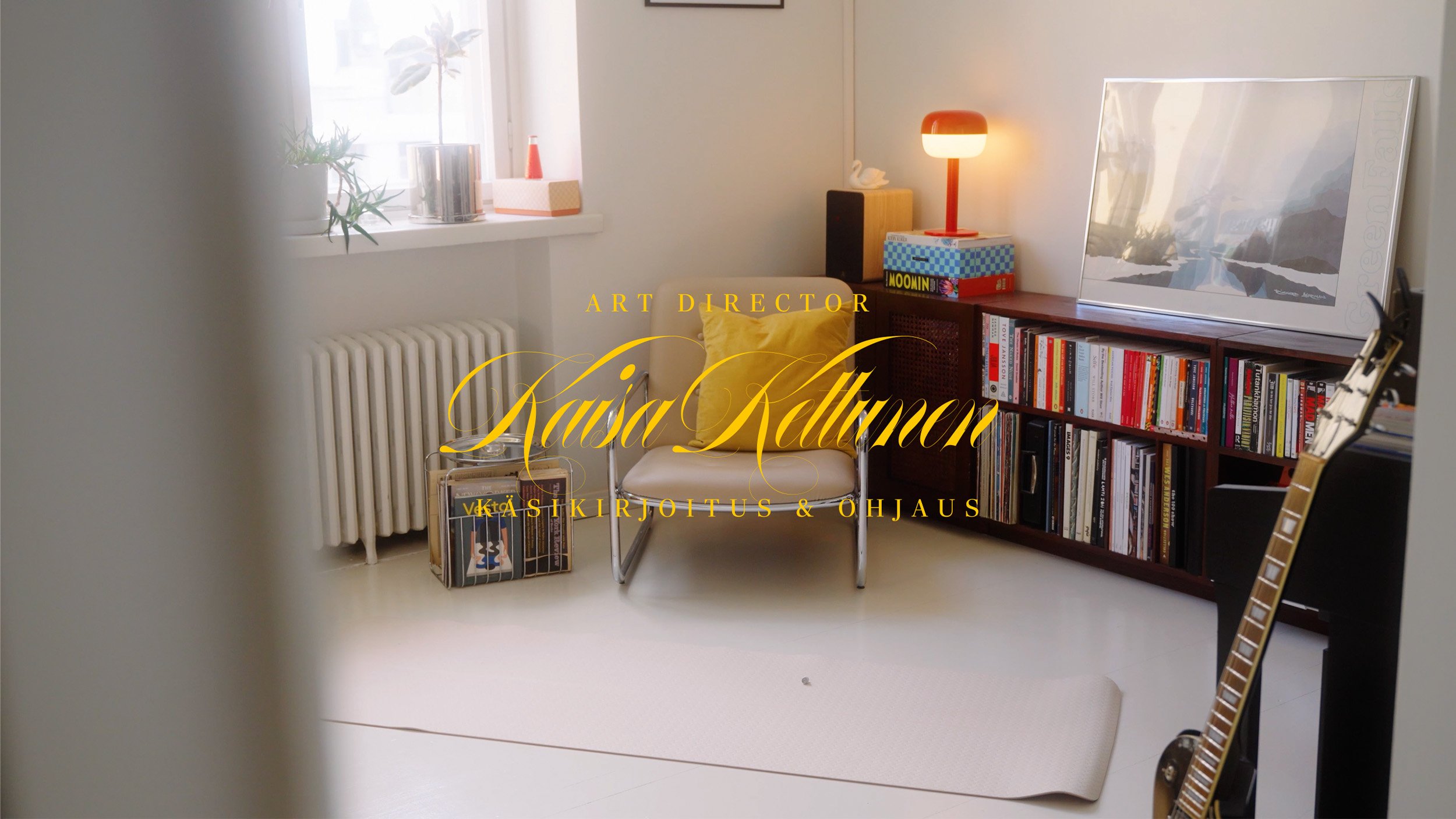 A cozy living room corner with a white armchair, yellow cushion, wooden bookshelf filled with books, a framed mirror, a guitar, and a small lamp on top of the bookshelf, illuminated by natural light from a window.
