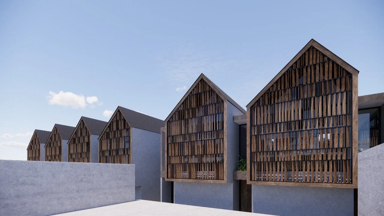Modern residential buildings with gabled roofs and wooden lattice facades, set against a clear sky.