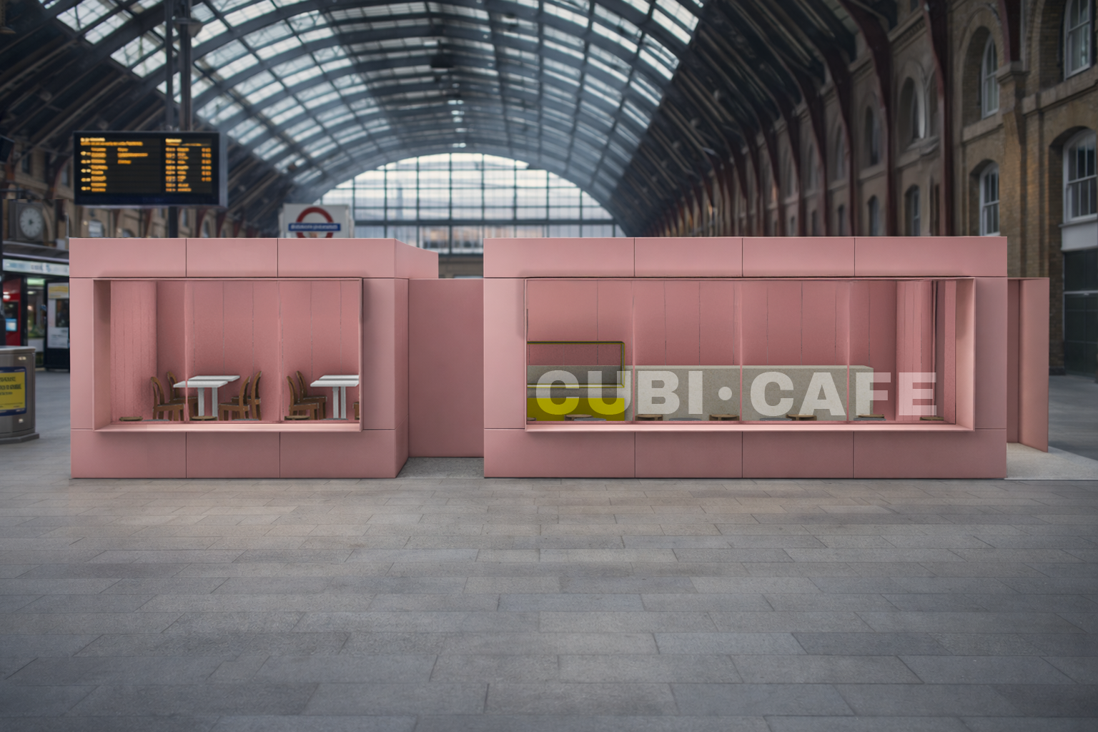 Three modern tiny houses with large glass windows, situated in a forest with a gravel path in front.