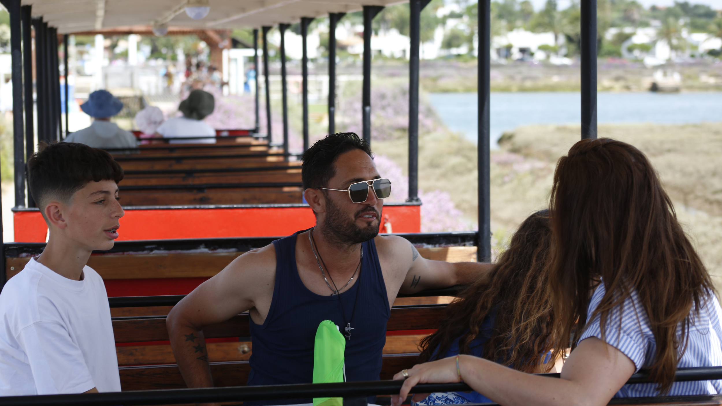 Family in the touristic train to Praia do Barril