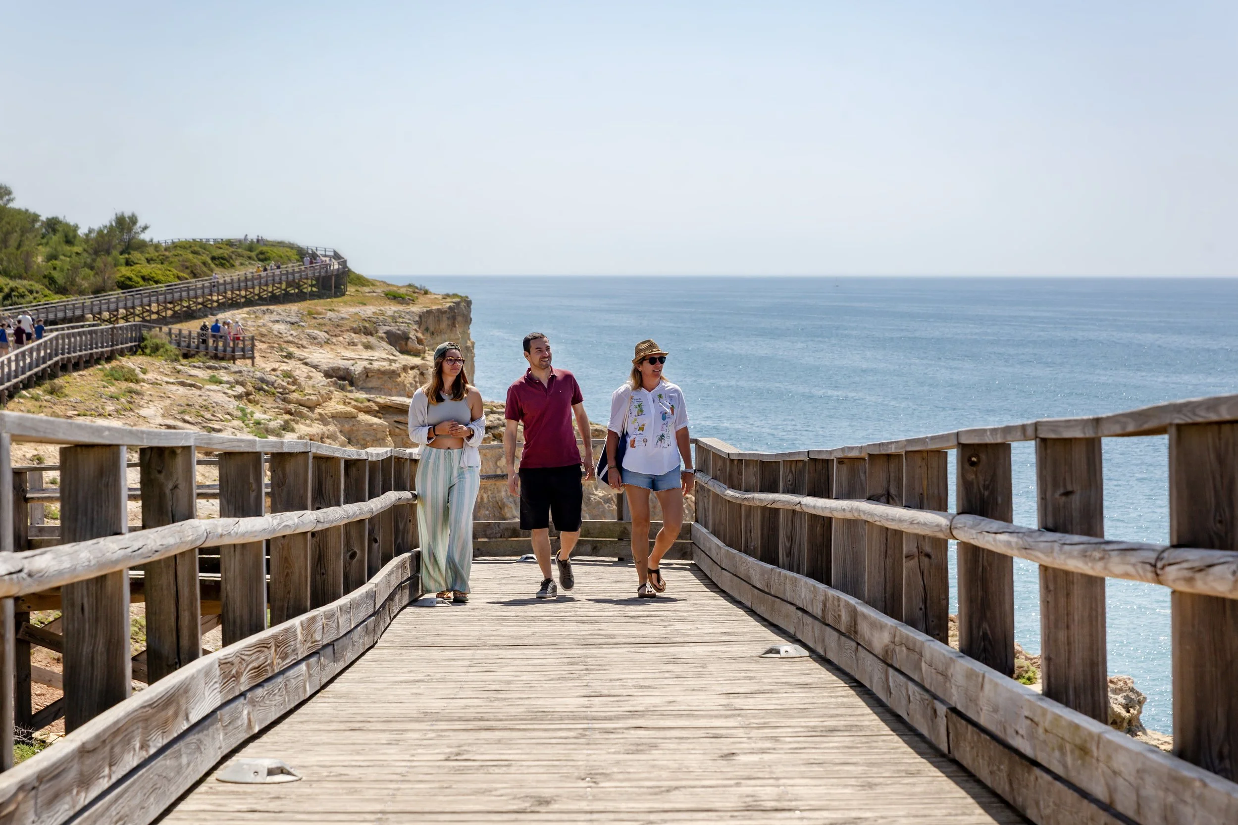three-people-walking-on-algar-seco-boardwalk.jpg