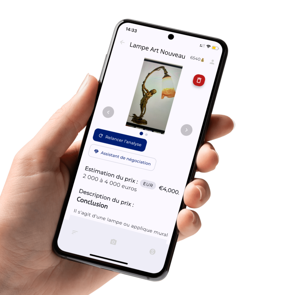 A person holding a smartphone displaying an app for evaluating the price of a lamp art piece. The app shows an image of a decorative lamp with a curved bronze sculpture base and a multicolored lampshade. The screen includes options for analysis, negotiation, and details like price estimate and description in French.