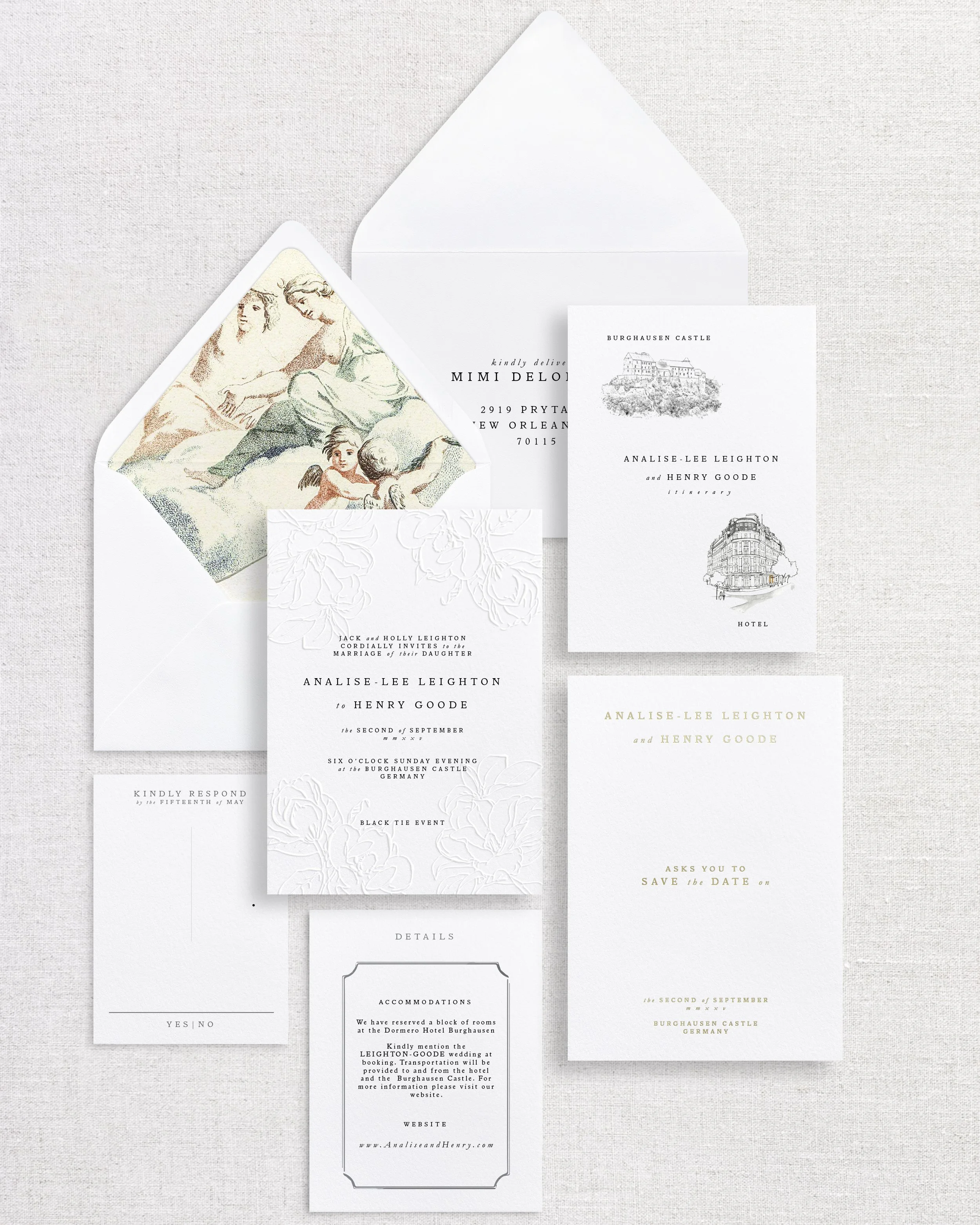 Wedding invitation and related stationery on a light fabric background, including an envelope, RSVP card, and details card with embossed floral design.