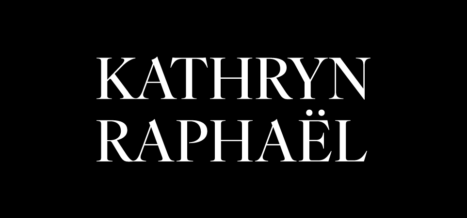 Black background with white text that says 'Kathryn Raphaël' in a stylish font.