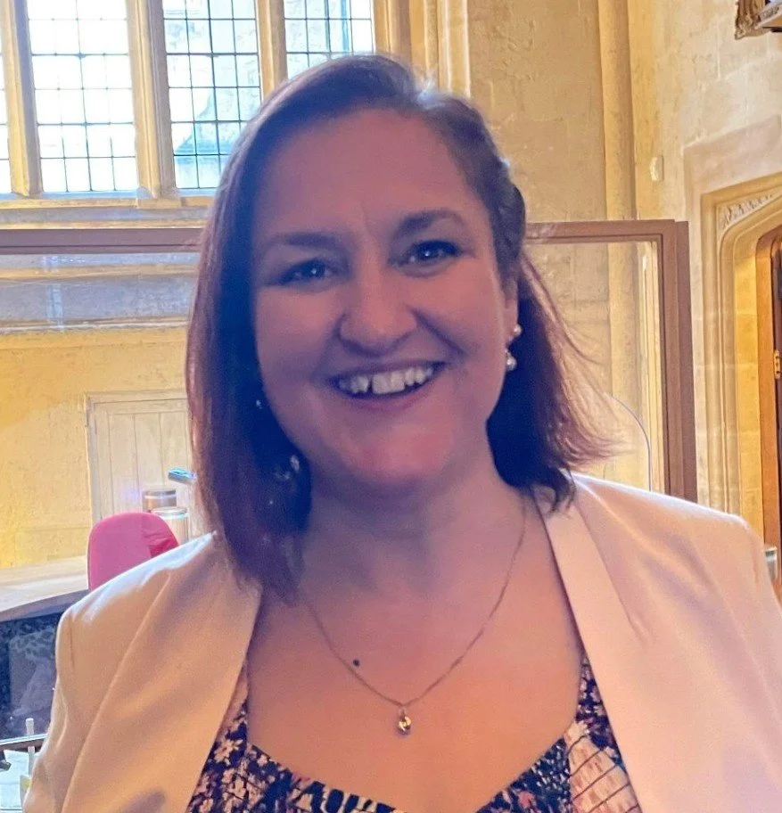 Smiling woman with shoulder length brown hair