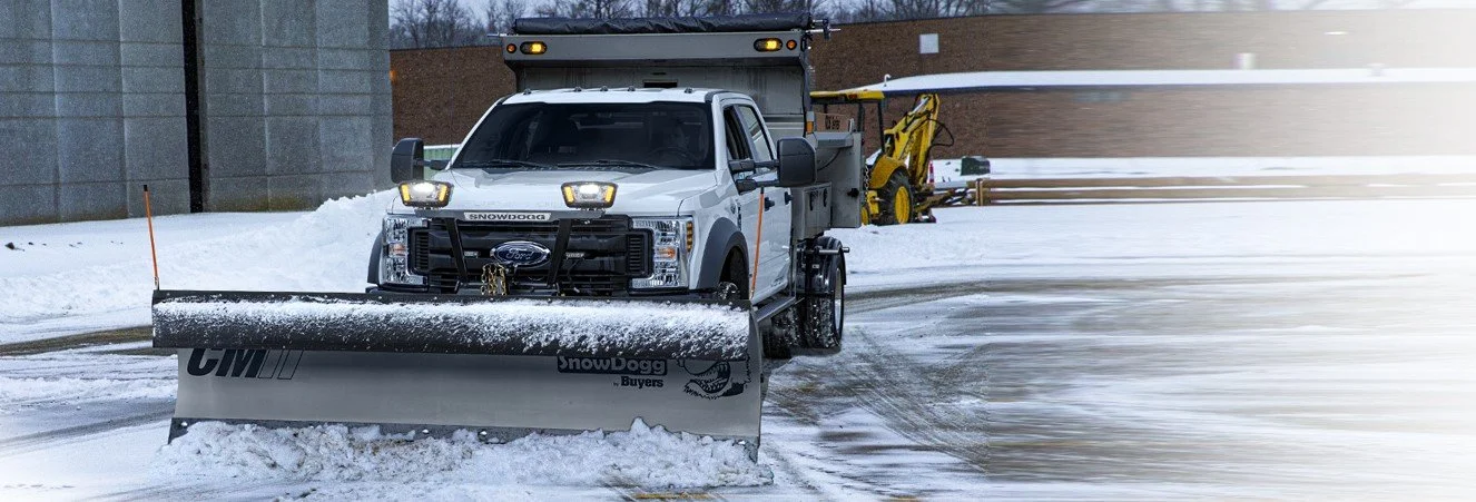 SnowDogg CM100II Snow plow with LED headlights mounted to a Super Duty Ford Truck
