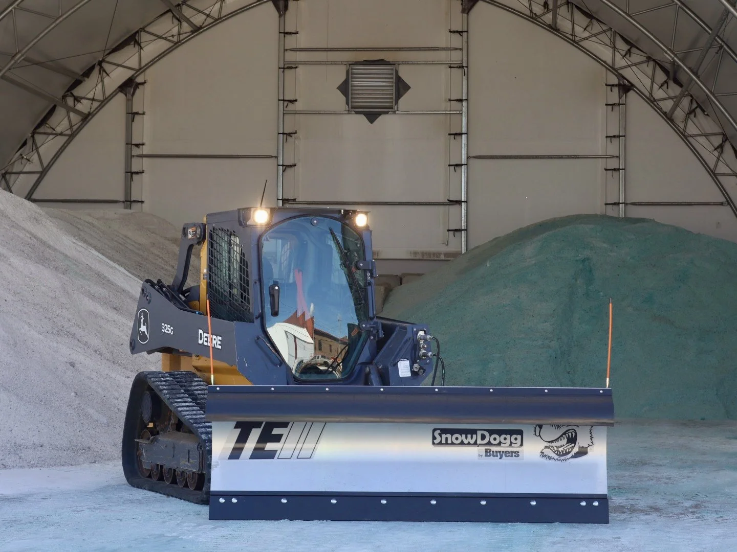 John Deere 325G Skid Steer with TE80II SnowDogg snow plow mounted.