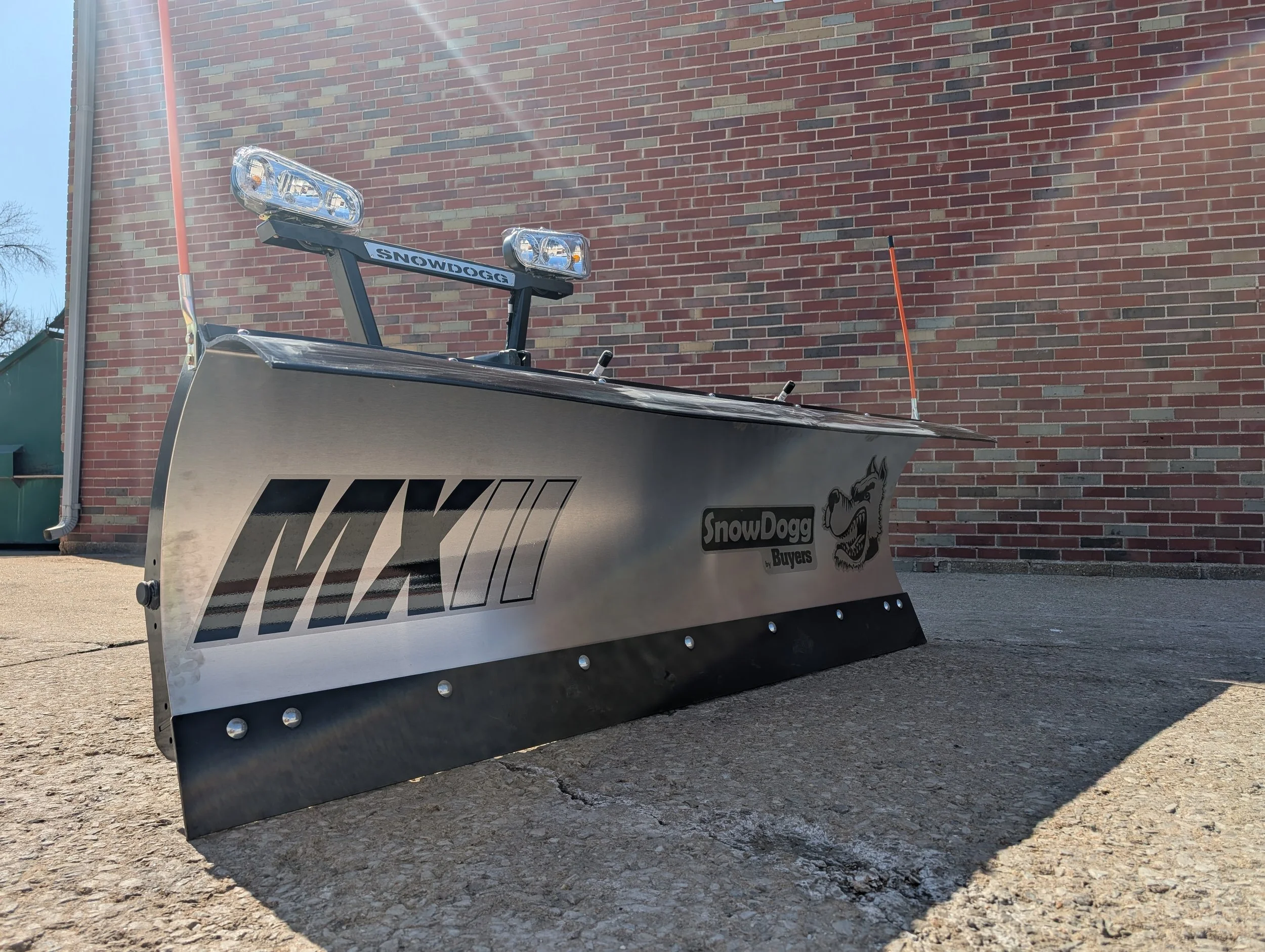 Product listing photo of a SnowDogg MX75II snow plow with halogen headlights