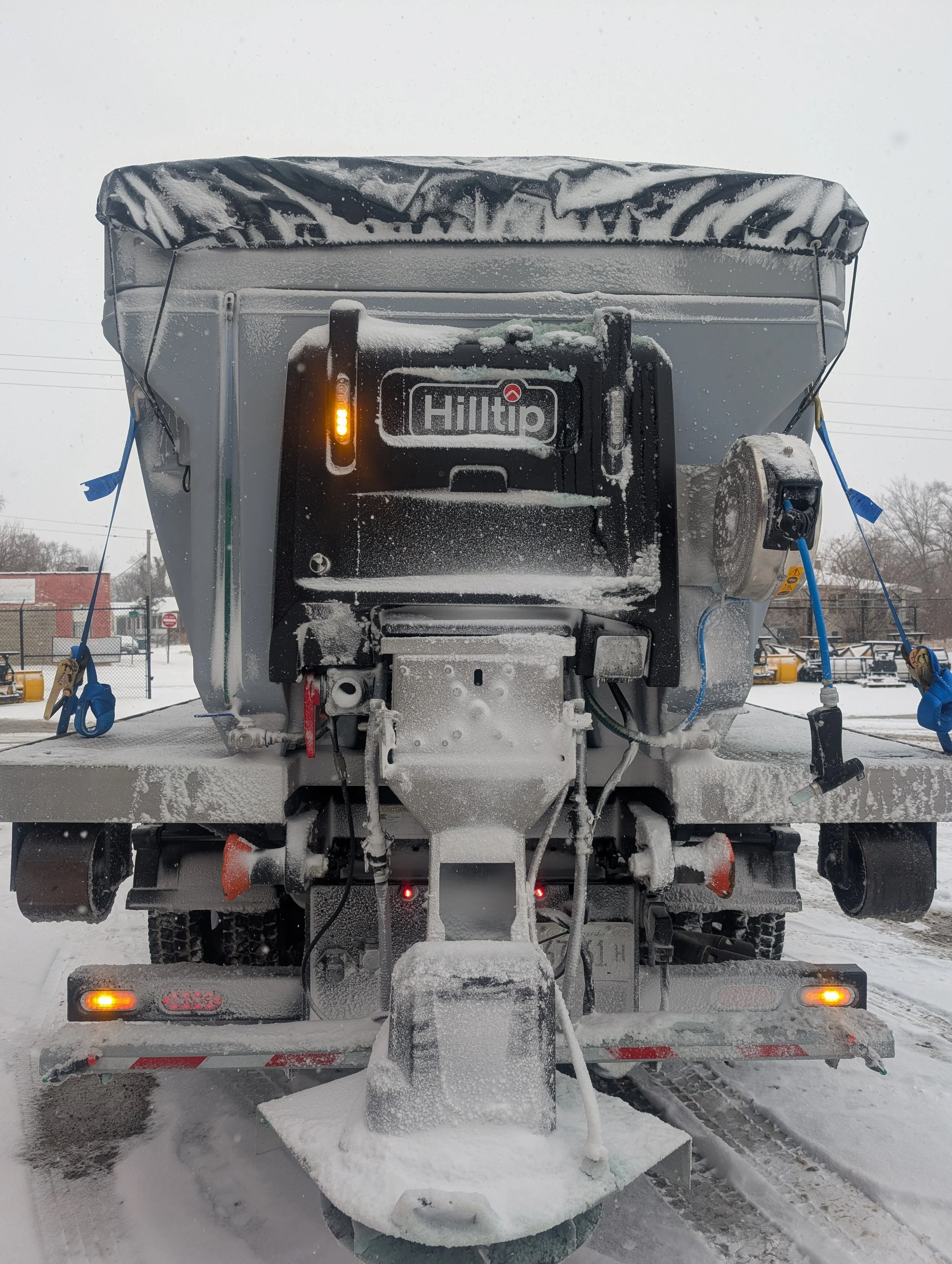 Action shot of a Hilltip Combination salt spreader with liquid capabilities