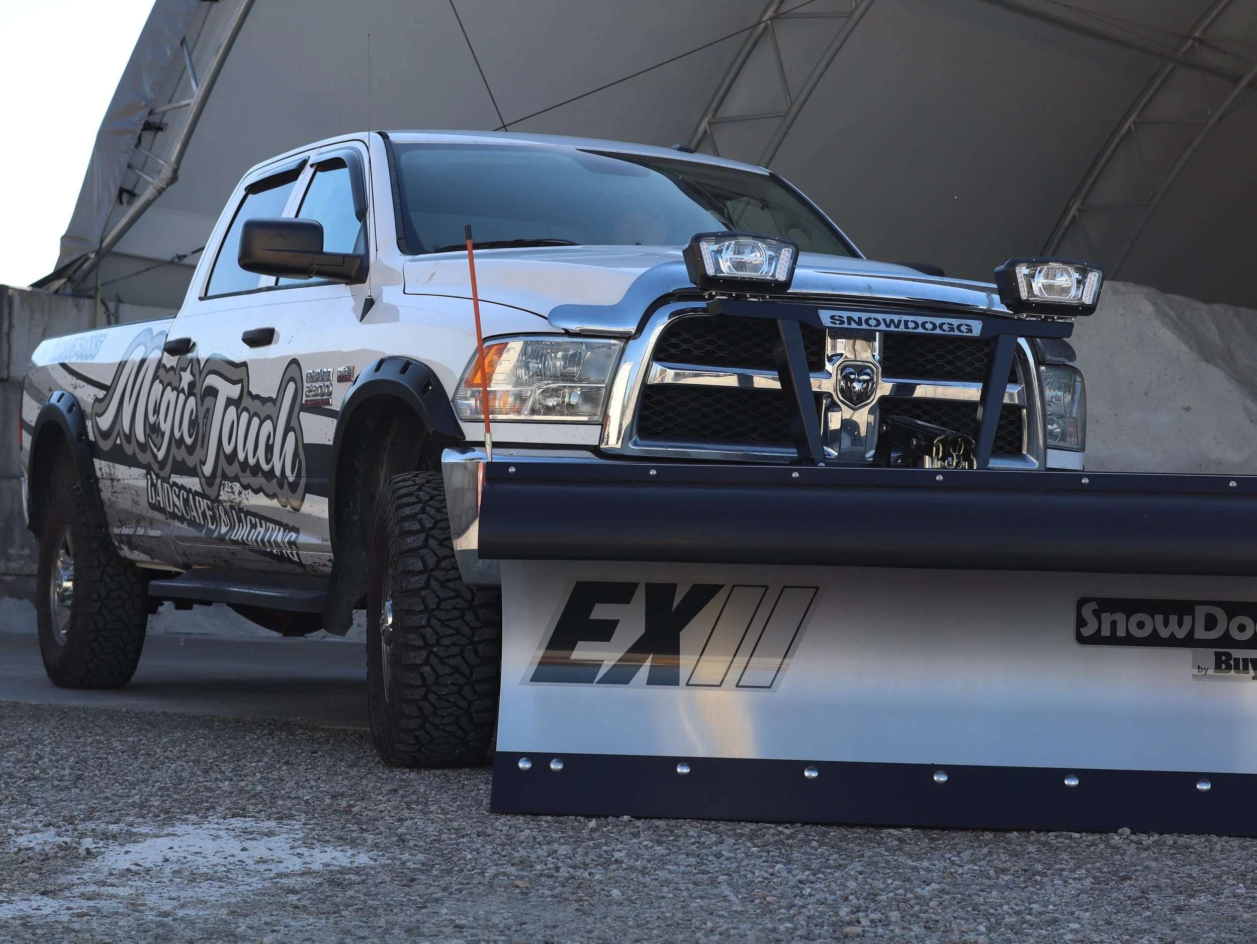 Beauty shot of a SnowDogg EX80II snow plow mounted to a 4th gen RAM 2500