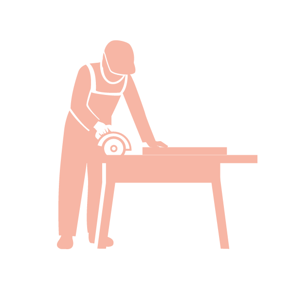 Silhouette of a person using a circular saw on a workbench