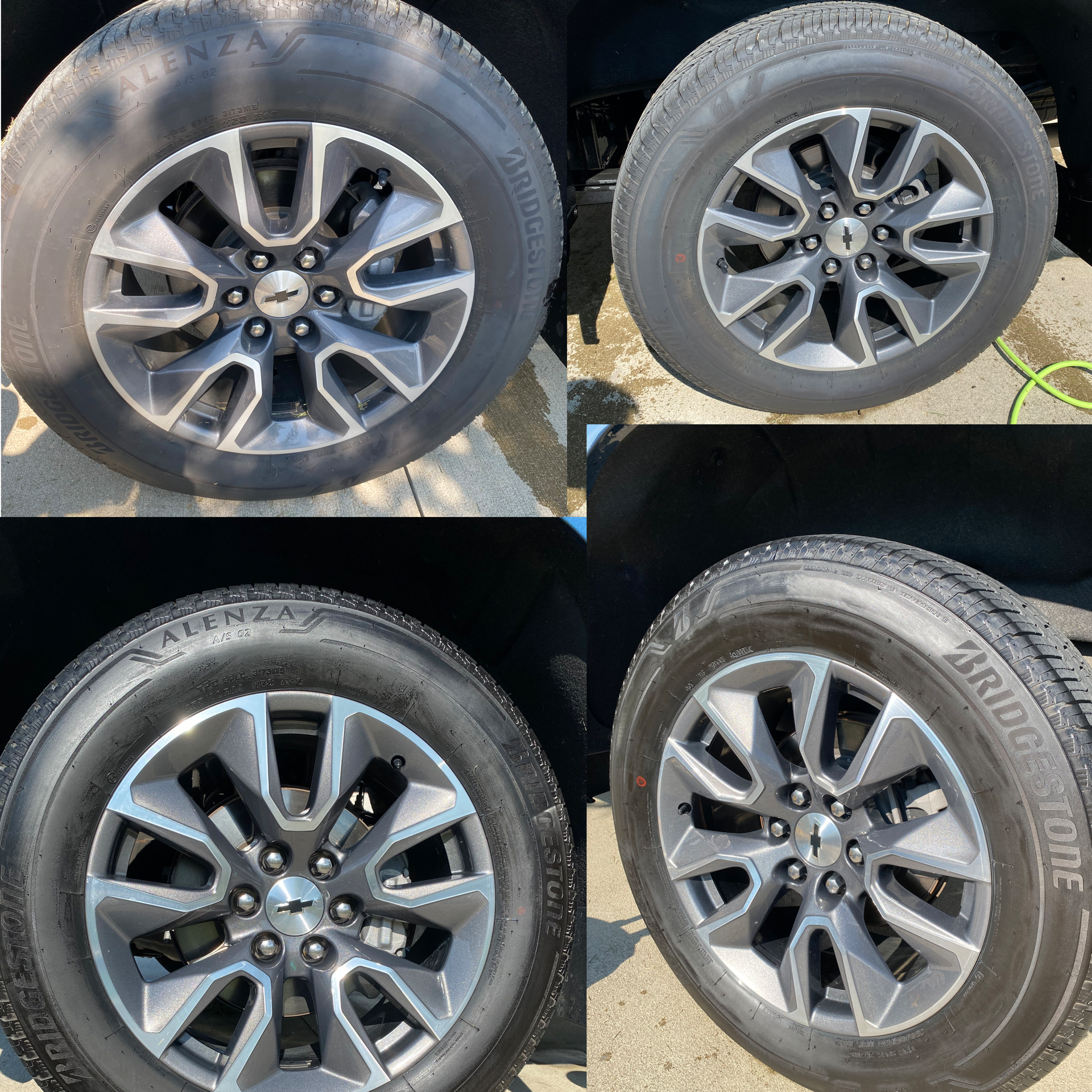Four car tires with alloy wheels, two with clean shiny rims and two with dirt and grime, on a concrete surface with shadows and a green hose nearby.