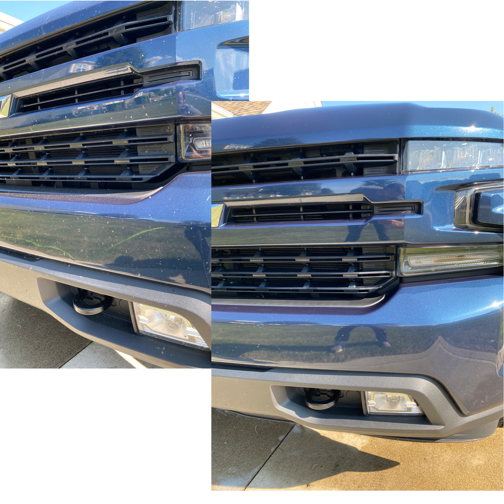 Close-up view of the front of a blue pickup truck, showing the grille, headlight, and bumper, with sunlight reflecting off the surface.