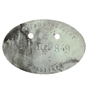Close-up of a coin with the number 849 and partially visible text around it.