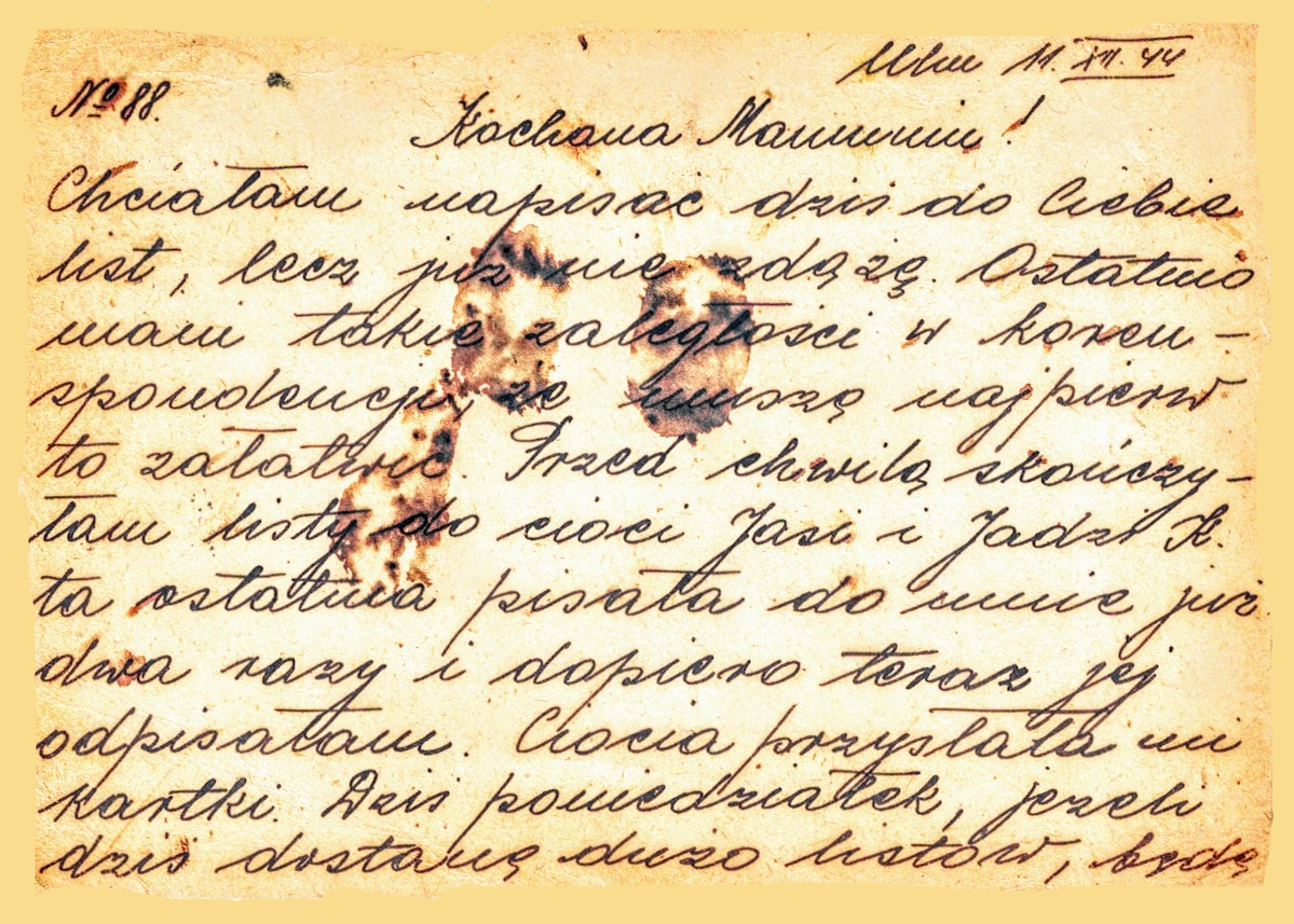 A handwritten letter in cursive script written in Polish, with visible burn marks and discoloration on the paper.