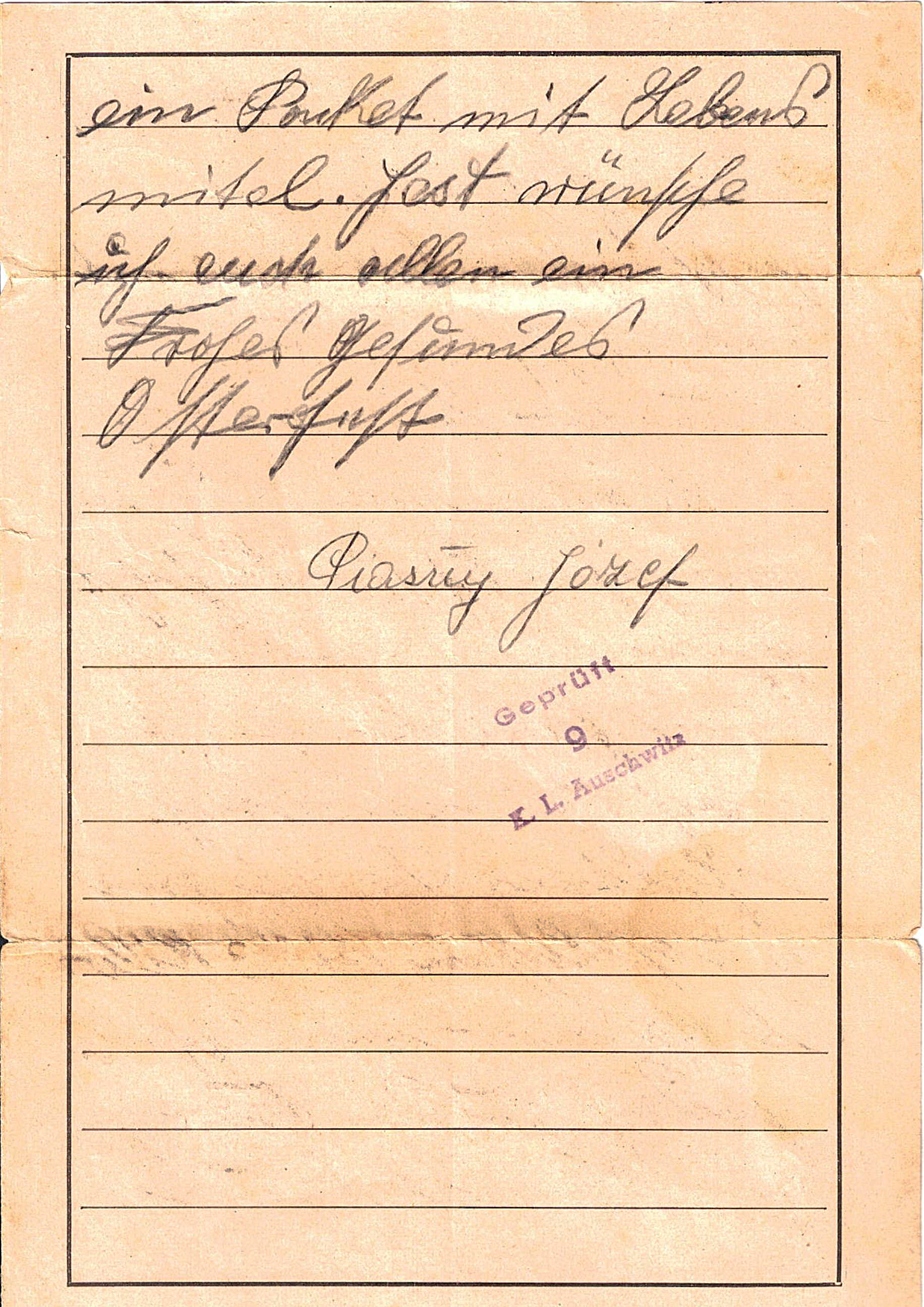 Handwritten note on aged paper with German writing and purple ink stamp, referencing the Auschwitz concentration camp.