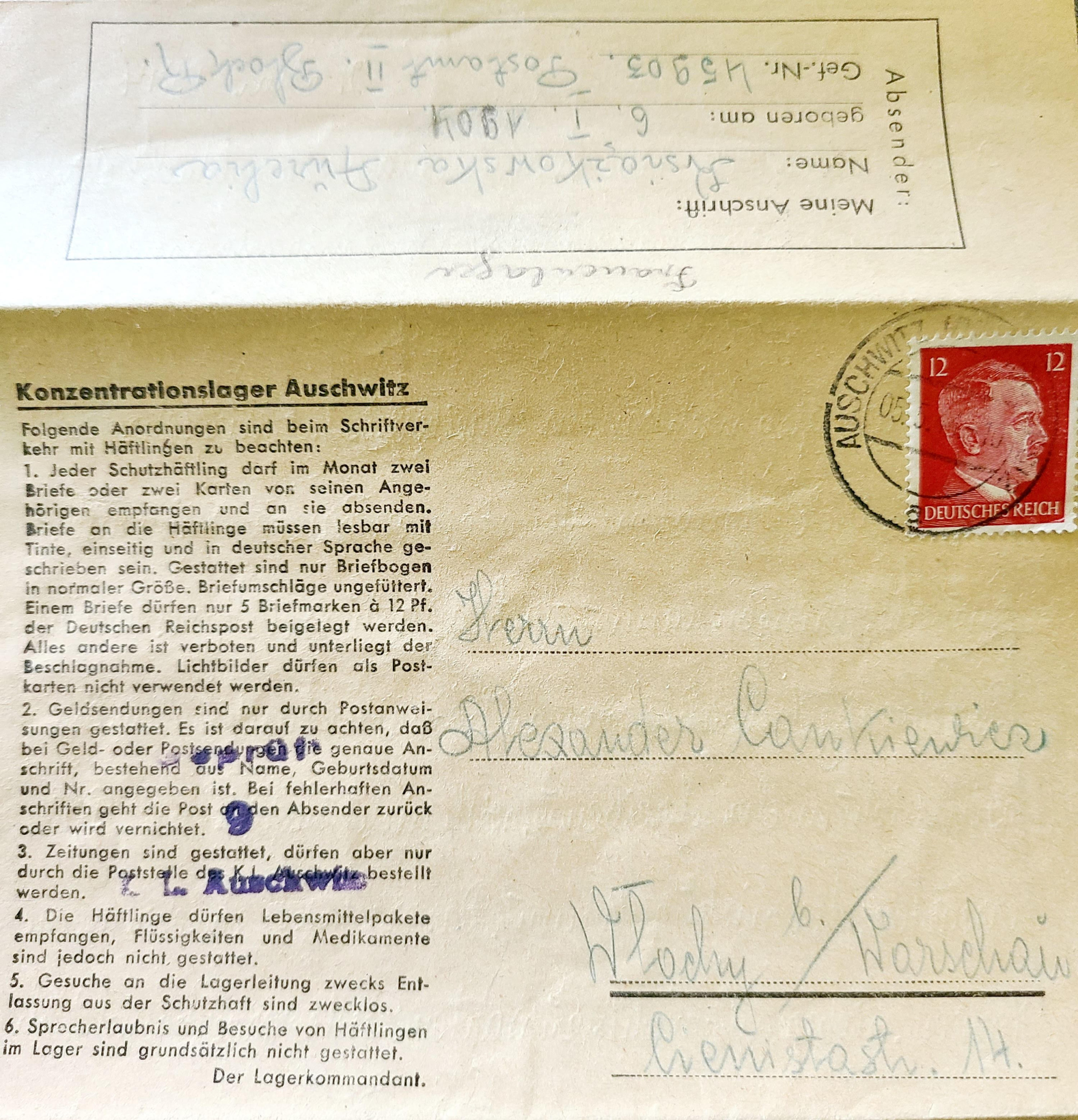 A historical postcard from Auschwitz concentration camp with German text and a red postage stamp showing Adolf Hitler. The postcard contains instructions or rules in German related to the camp.