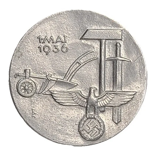A coin dated May 1, 1936, featuring a Nazi eagle holding a swastika and a ship with a cannon, includes German inscriptions.