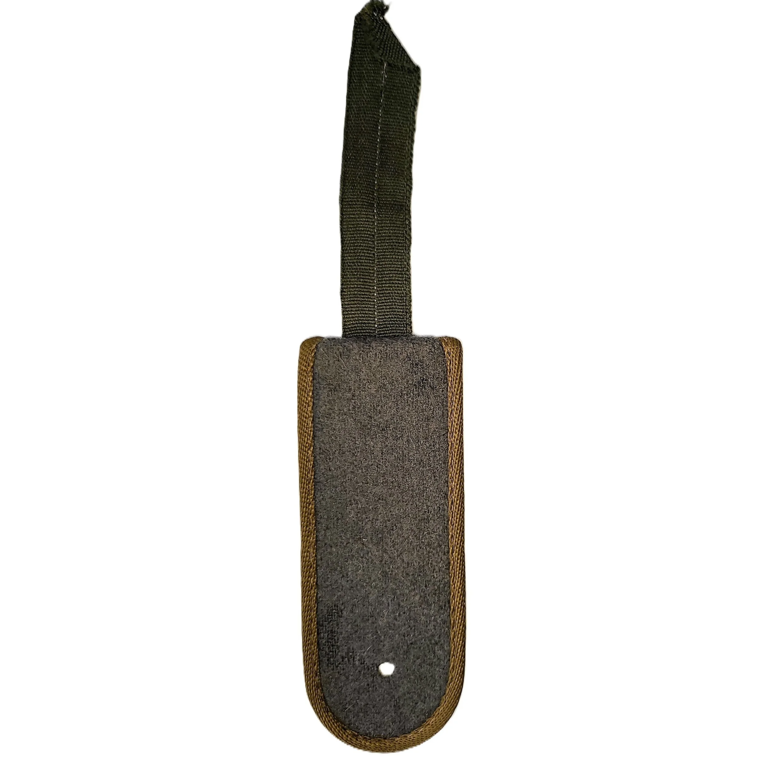 A black and brown skateboard grip tape cleaner with a strap for hanging.