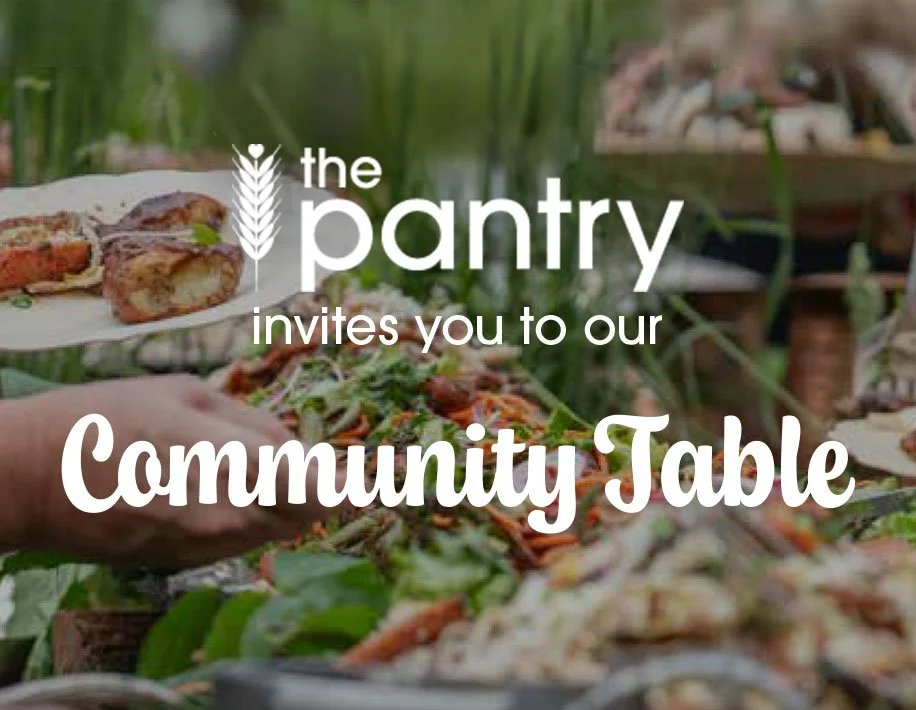 Image of a table with food. Text: The pantry invites you to our community table