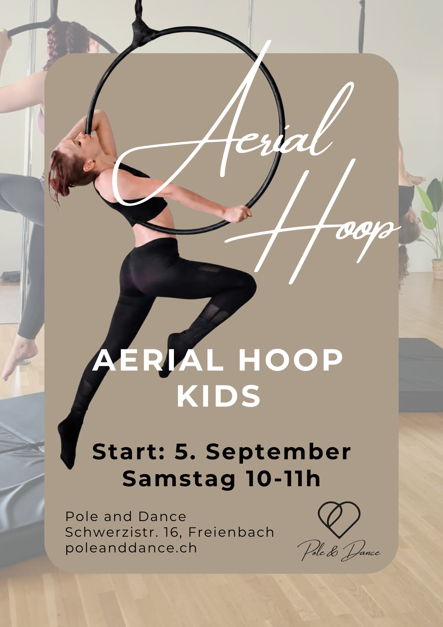 An aerial hoop instructor is hanging effortlessly in the air in an aerial hoop. She teaches aerial hoop classes for children in Freienbach in Canton Schwyz.