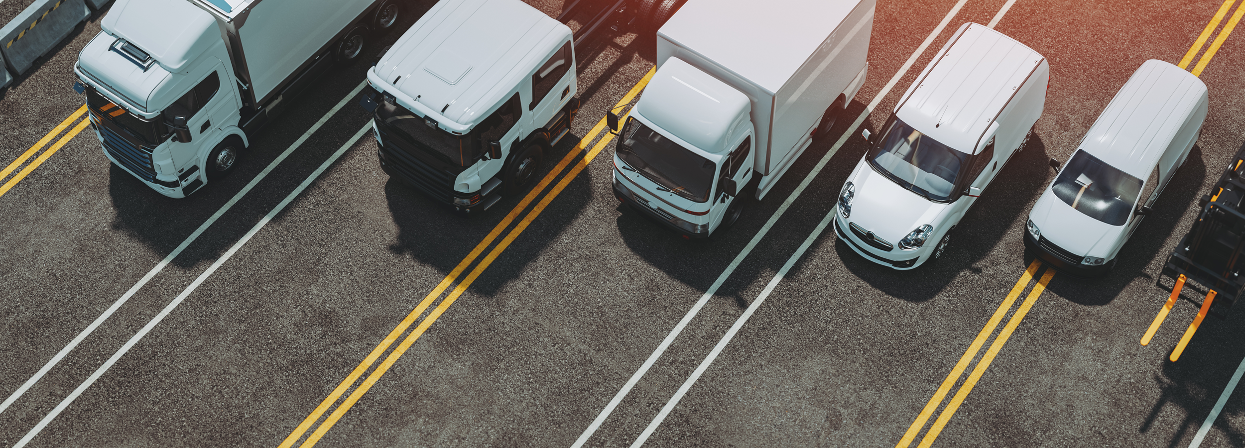 trucks of various sizes in a parking lot