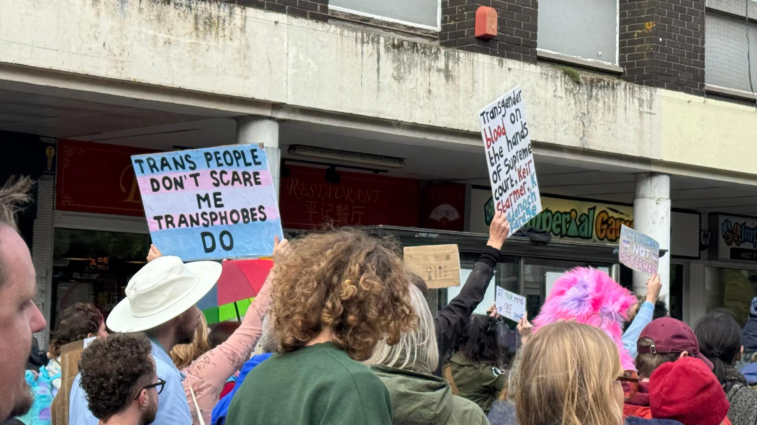 Signs: "Trans people don't scare me, tranphobes do"