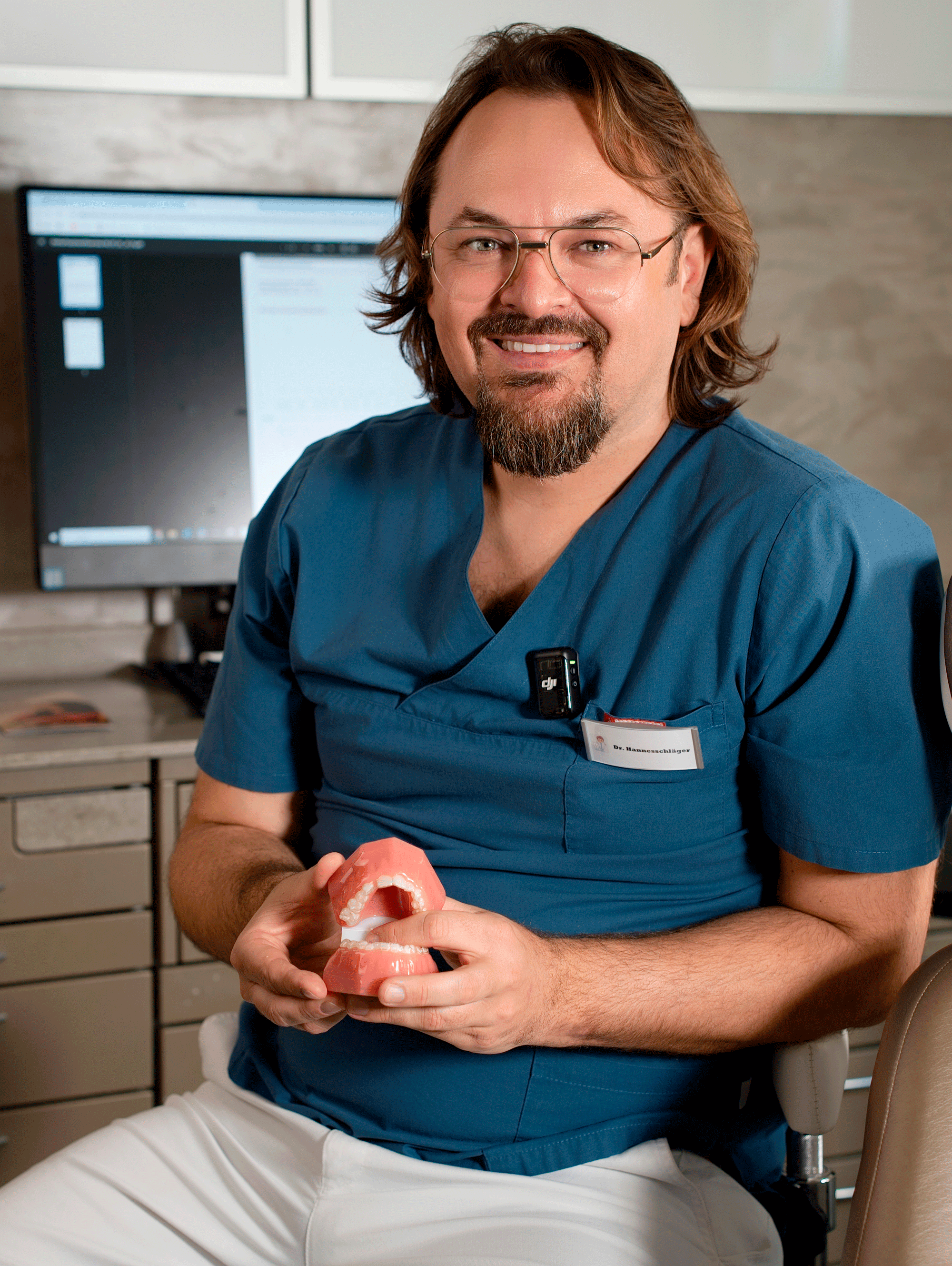 Dentist portrait in blue scrubs, medical photography New Moon Agency Klagenfurt