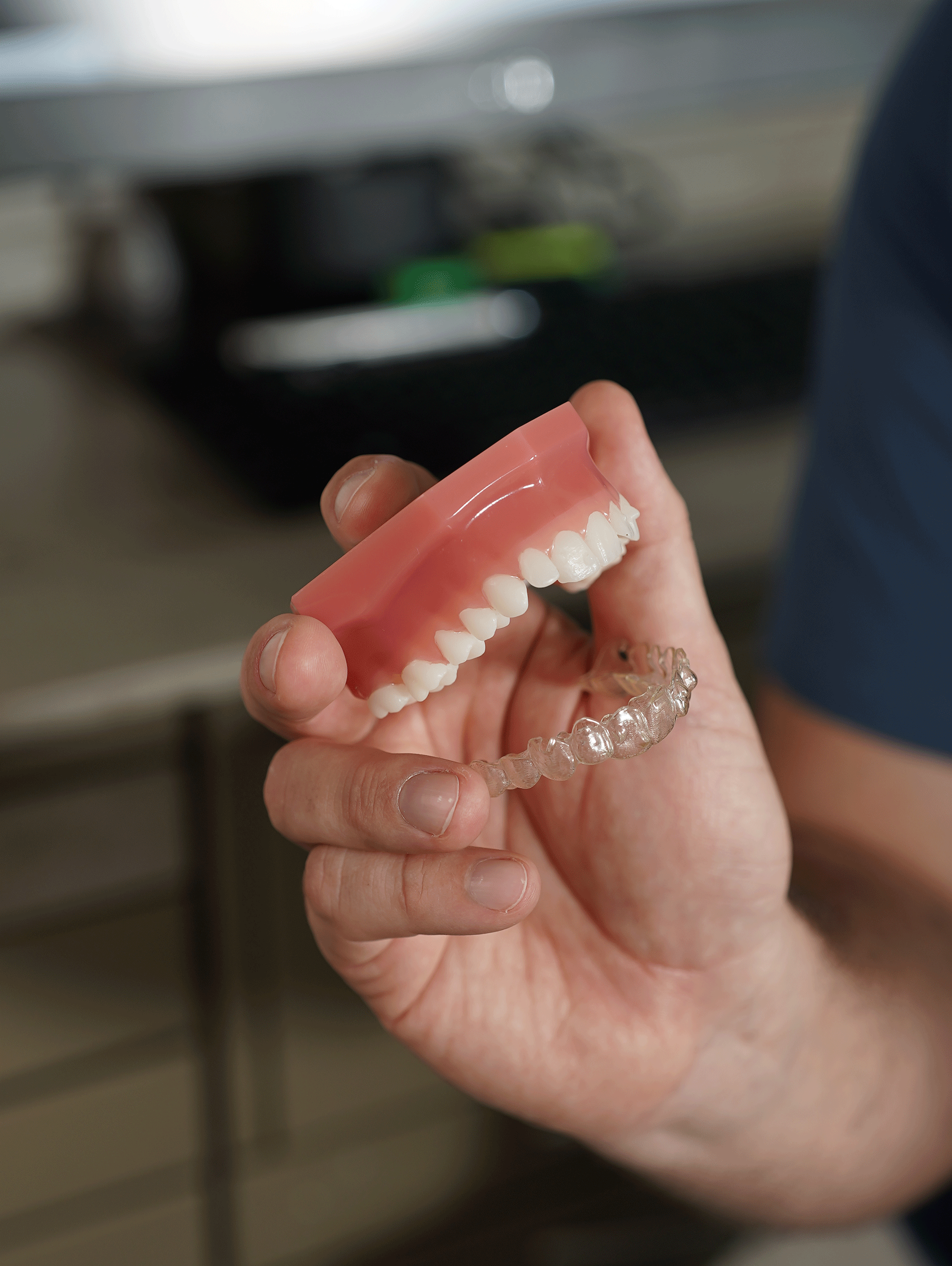 Dentist holding dental prosthesis, medical product photography New Moon Agency Klagenfurt