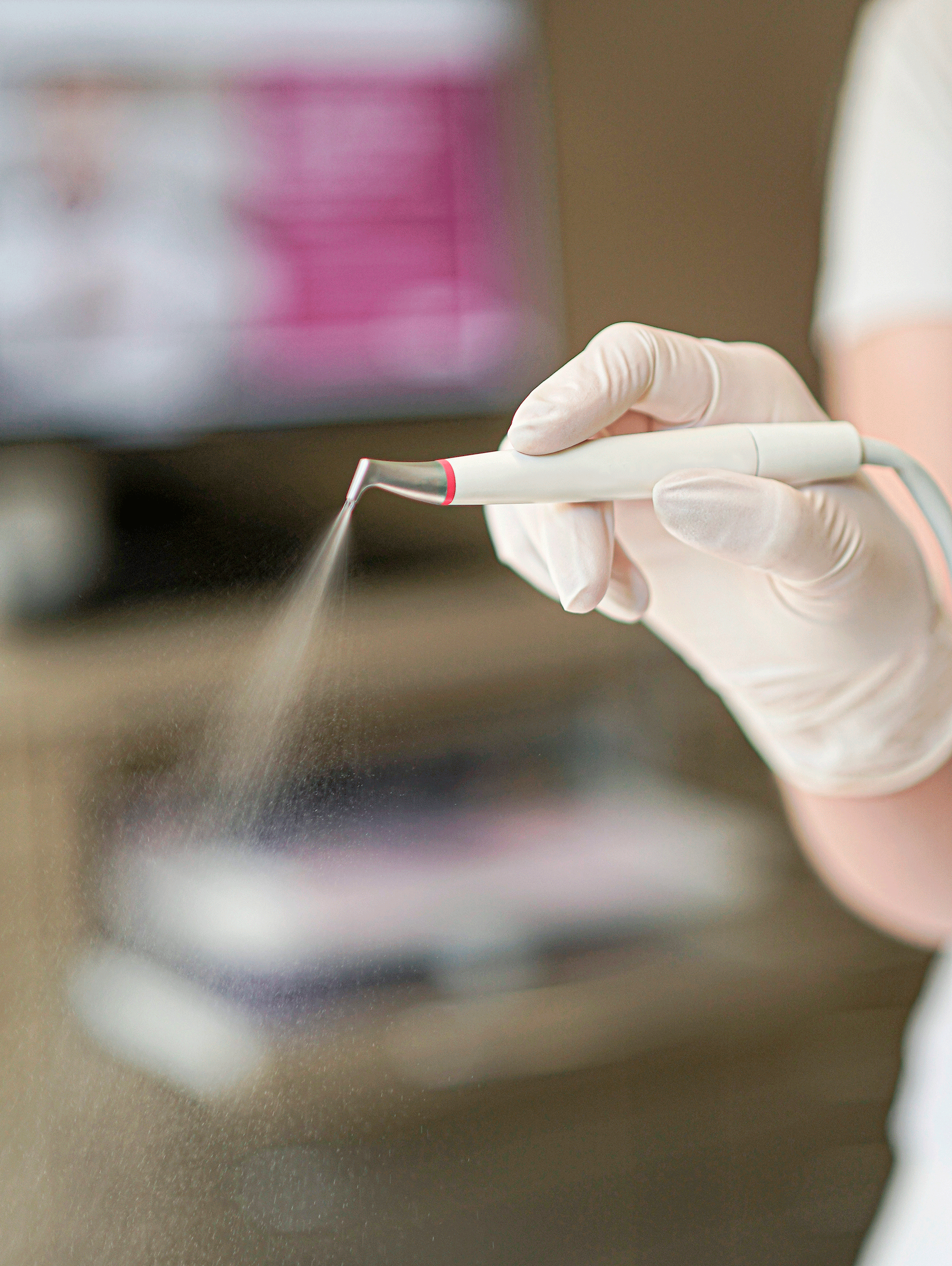 Dentist holding precision instrument close-up, medical photography New Moon Agency Klagenfurt
