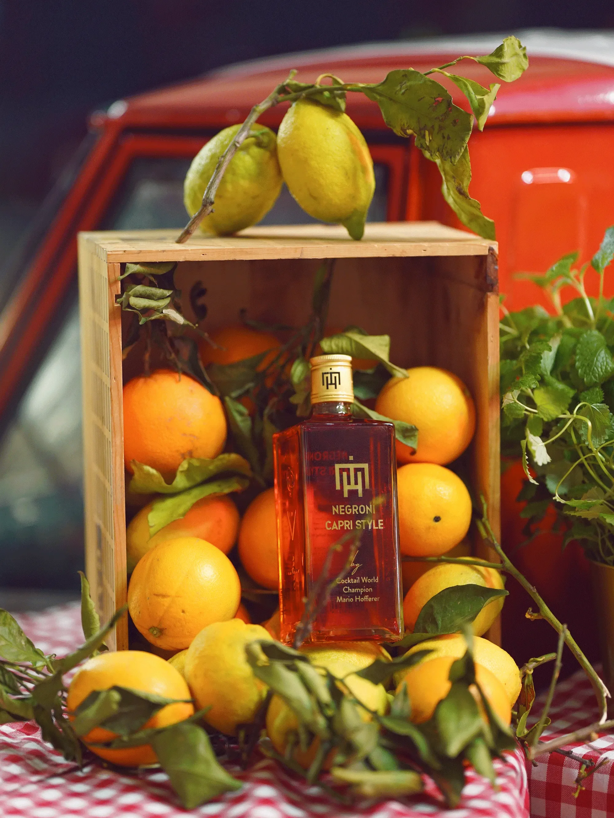 Italian spirits bottle with oranges and lemons, product styling — food photography New Moon Agency Klagenfurt