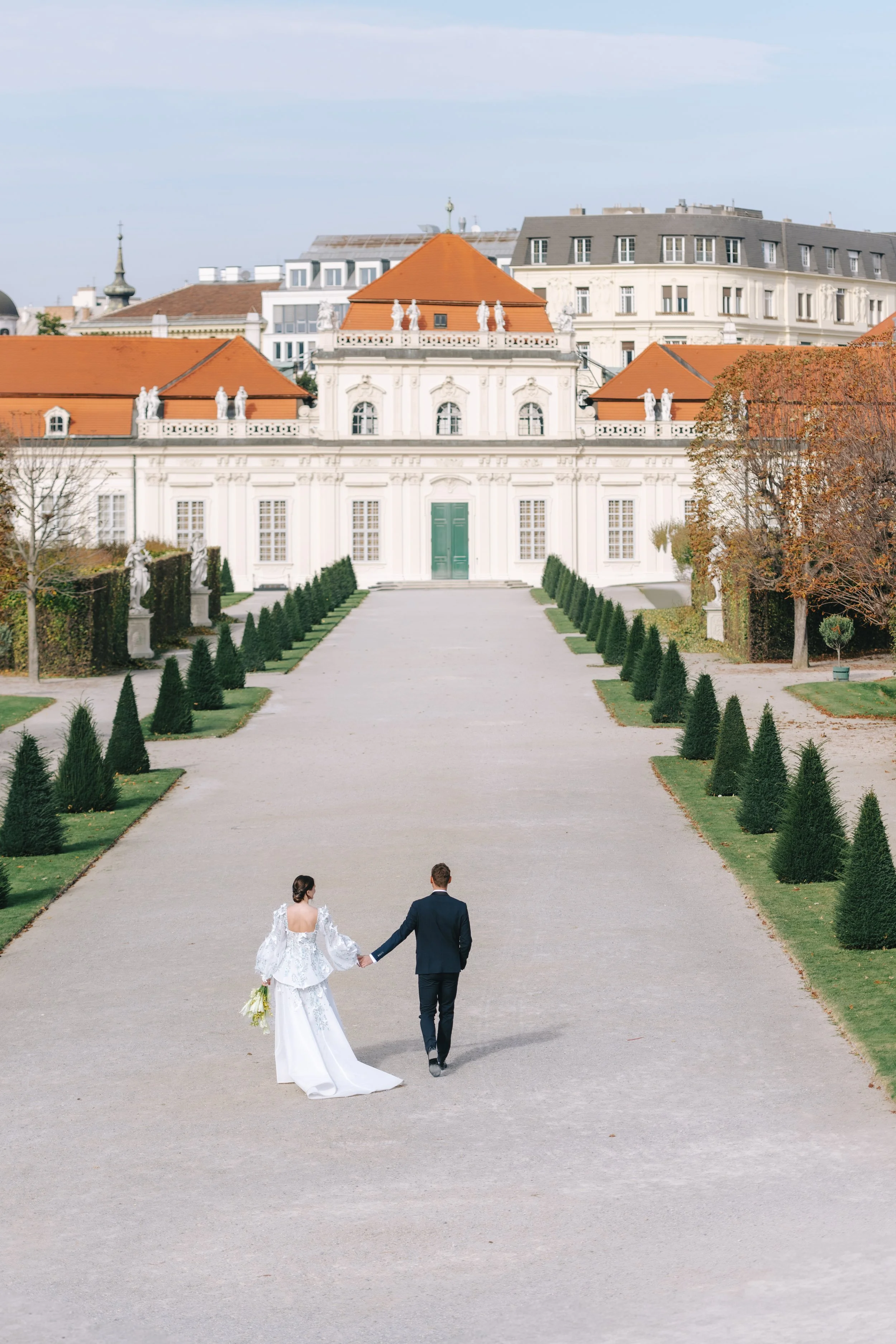 couple walking towards europian castle