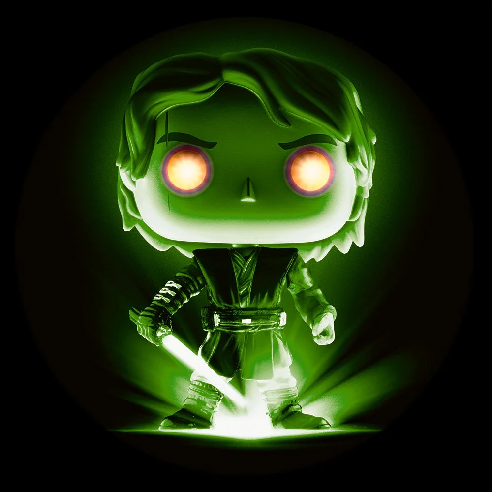Green glowing Funko Pop figure of a male character with brown hair, wearing a black outfit, holding a green lightsaber, with intense glowing eyes, and a dark background.