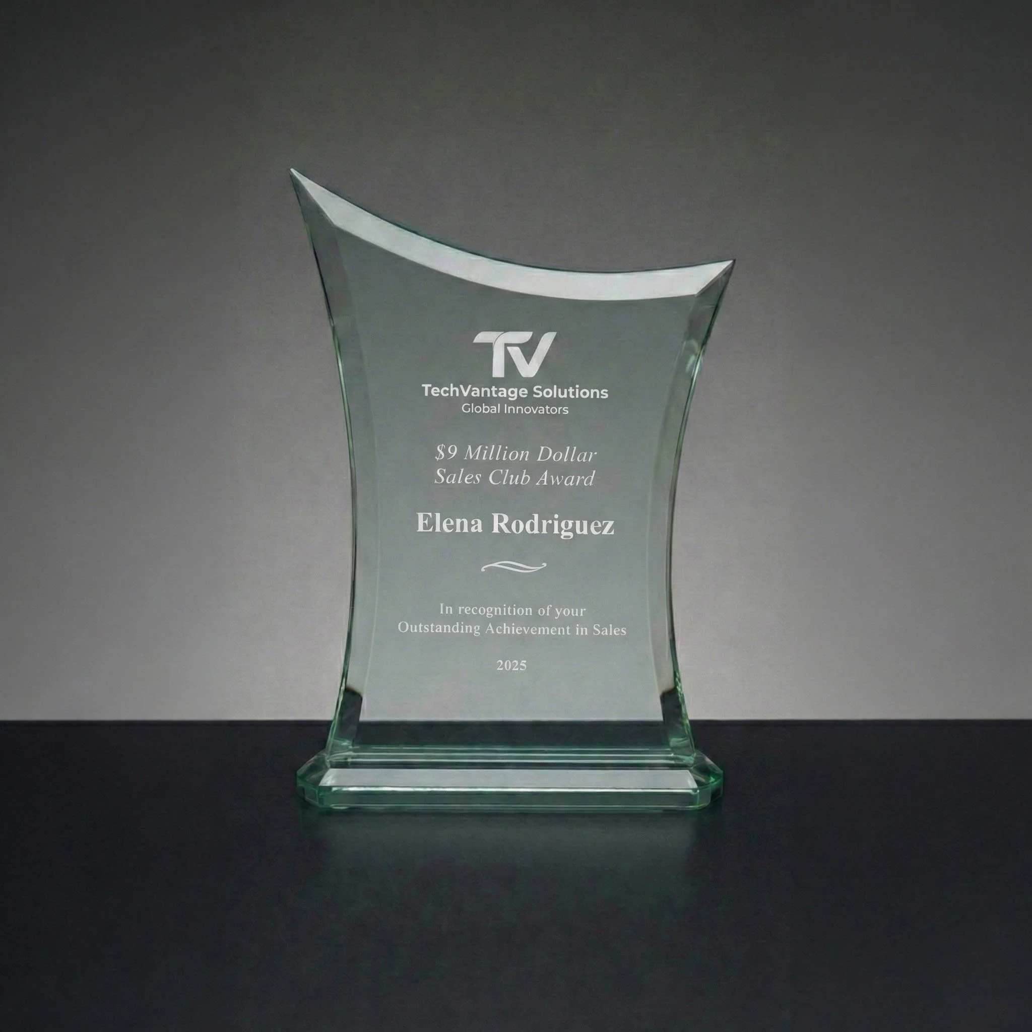 A glass award trophy with engraved text, awarded to Elena Rodriguez for outstanding achievement in sales in 2025 by TechVantage Solutions.