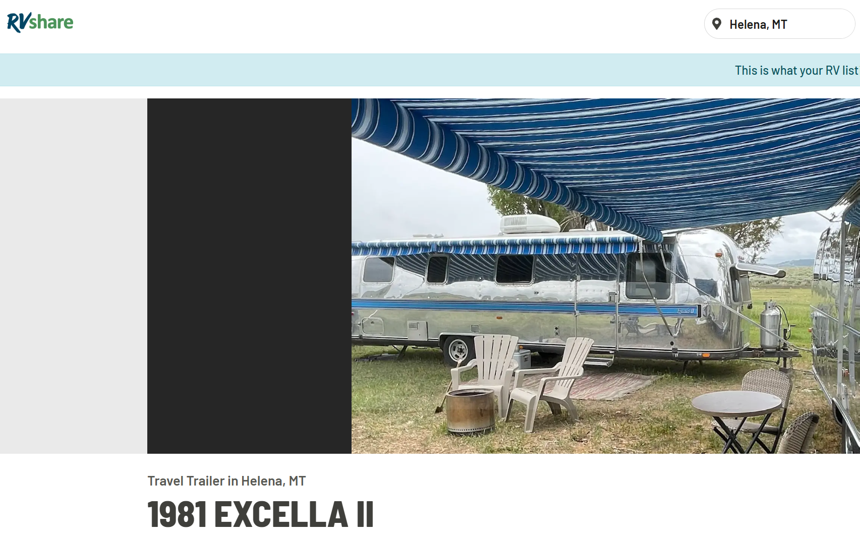 A shiny silver travel trailer with blue stripes parked on grass, under a blue and white striped awning, with outdoor chairs, a small table, and a fire pit in front.