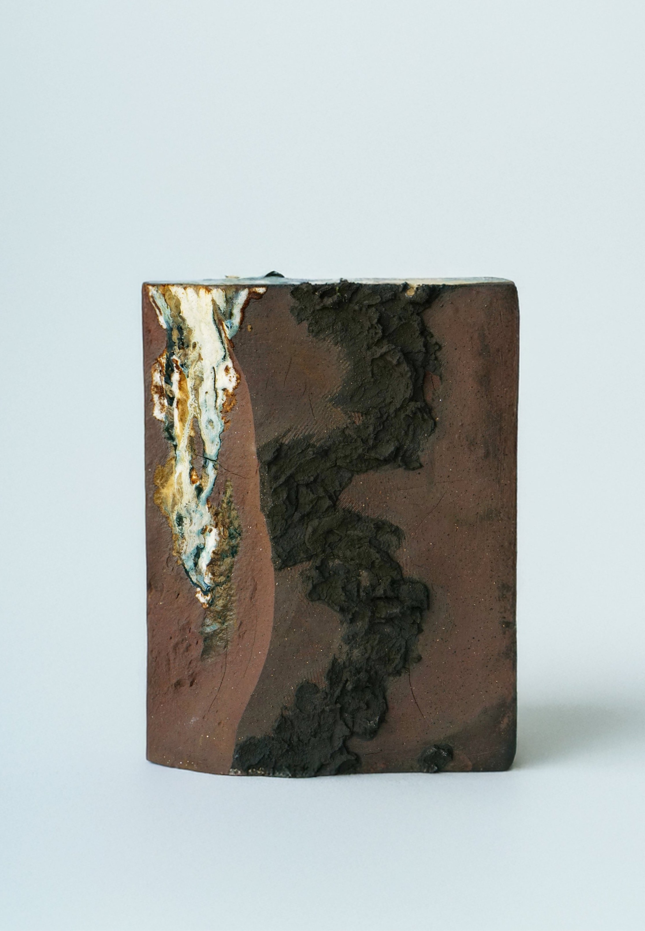 Water 1, 2024, Terra cotta clay, volcano black slip, glaze, 19 x 25.3 x 6.5 cm