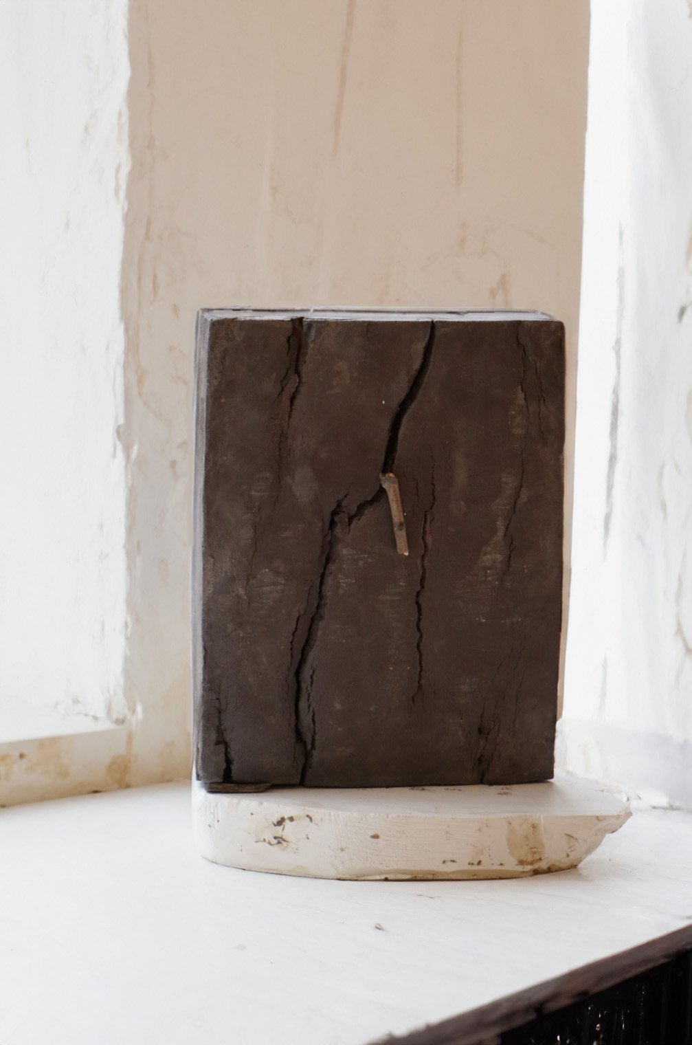 Wood 1, 2024, Volcano clay, wood stick, 29 x 36.5 x 9 cm