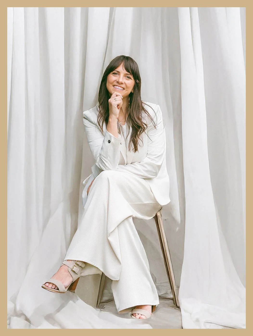 A woman sitting on a chair.