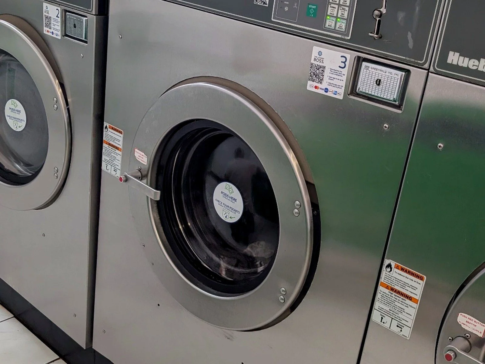 Large-capacity front-loading washer inside WSHFLD Laundry for bedding, comforters, family laundry, and bulky loads.
