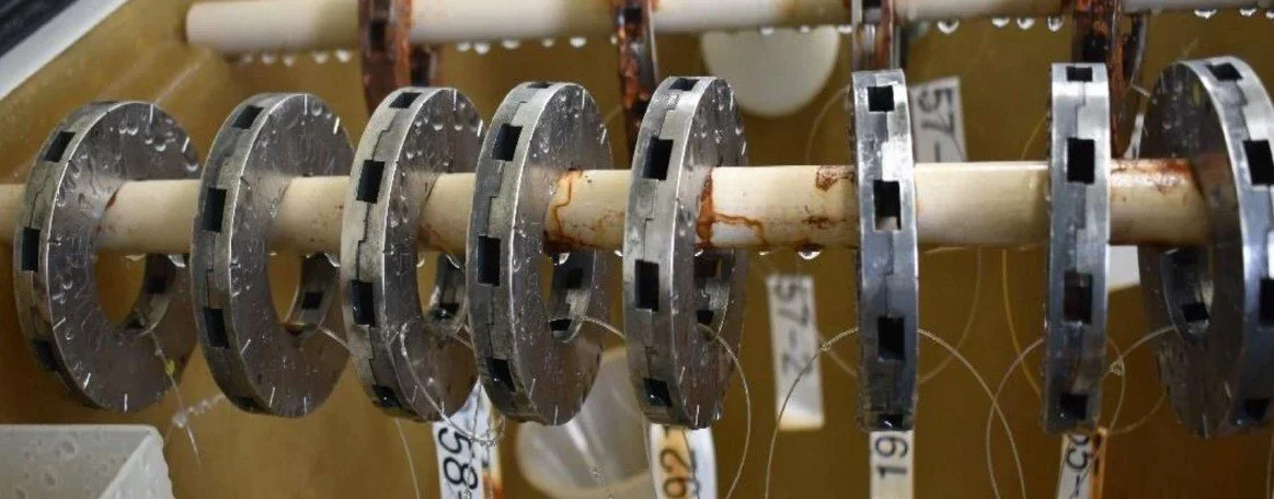 Velocity Washer specimens during 1,000-hour neutral salt spray exposure in the ASTM B117 corrosion chamber.