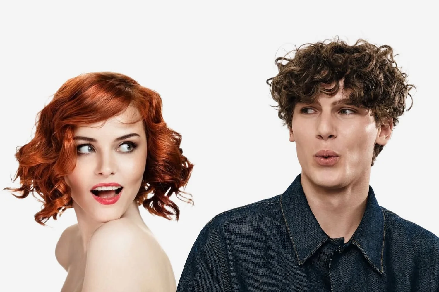 A red-haired woman looking surprised and a curly-haired man making a playful face, both against a white background.