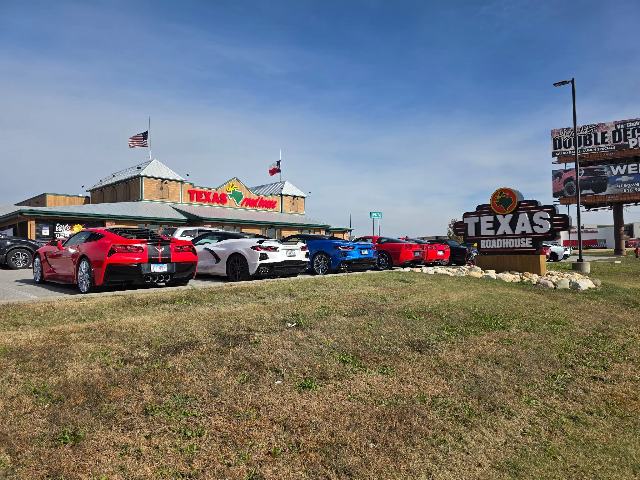 Twelve Corvettes lined up for Veterans to parade through.